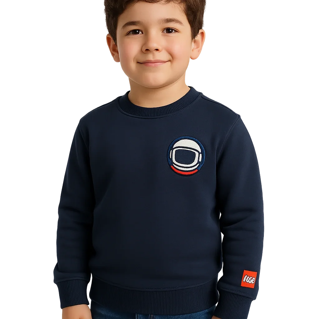 a boy wearing a blue sweater