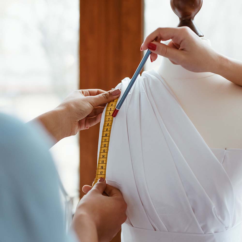 close up of taking measurements for new dress 7KG77LN