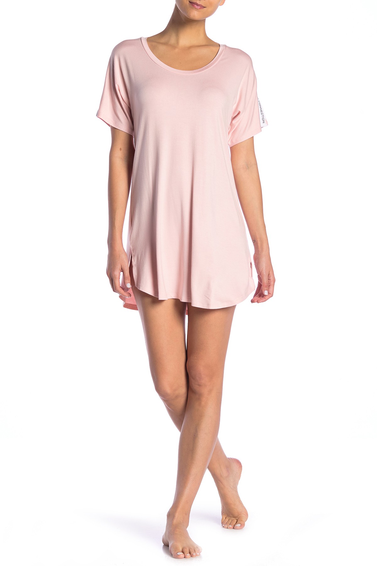 Comfortable womens wear: A woman donning a pink t-shirt epitomizing loungewear fashion.