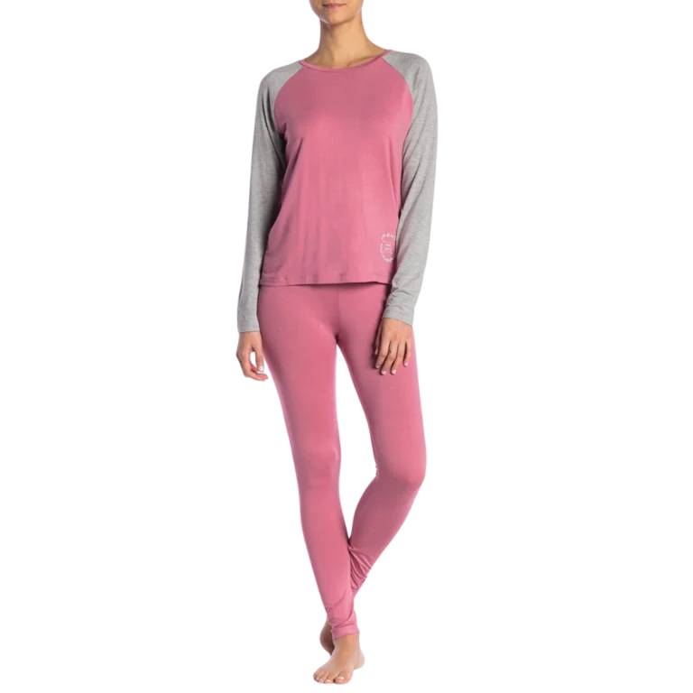 a woman wearing pink and grey pajamas