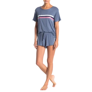 a woman in a blue shirt and shorts