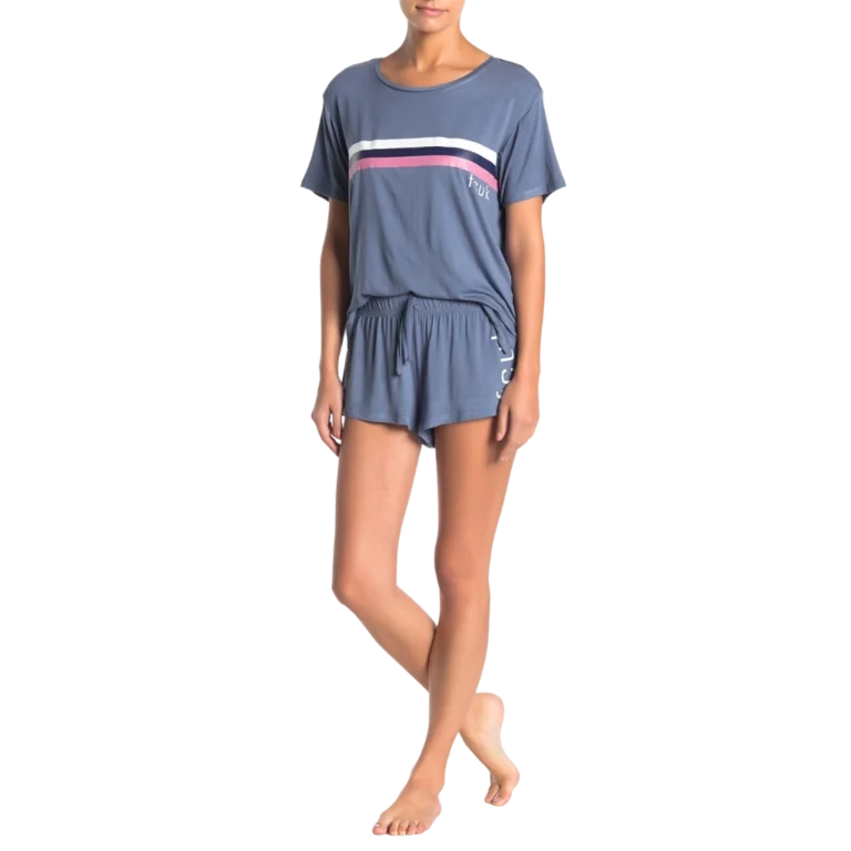 a woman in a blue shirt and shorts