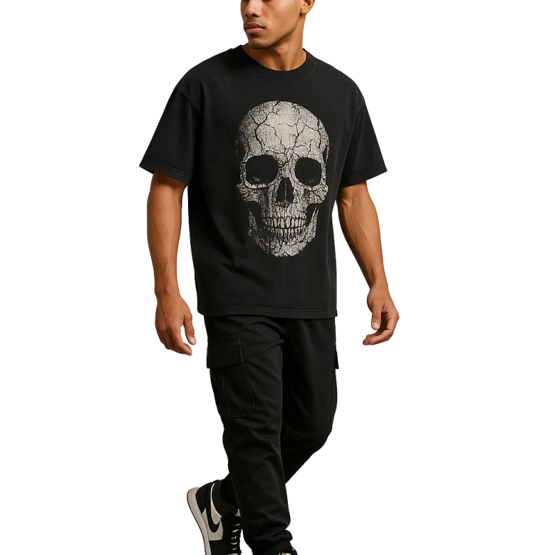 a man walking in a black shirt with a skull on it