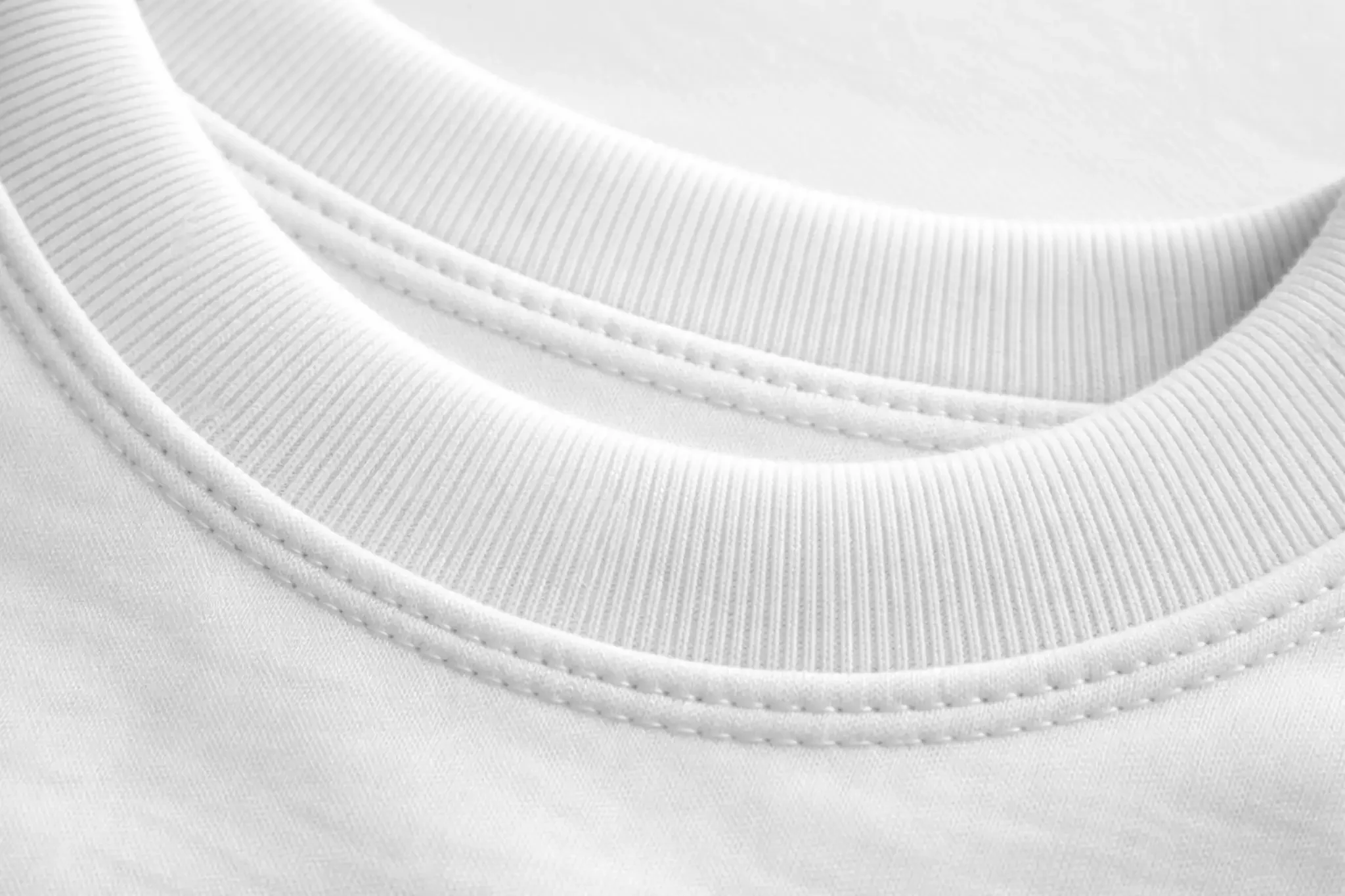 Crew neck t-shirt rib collar stitching detail showing neckline construction and fabric quality